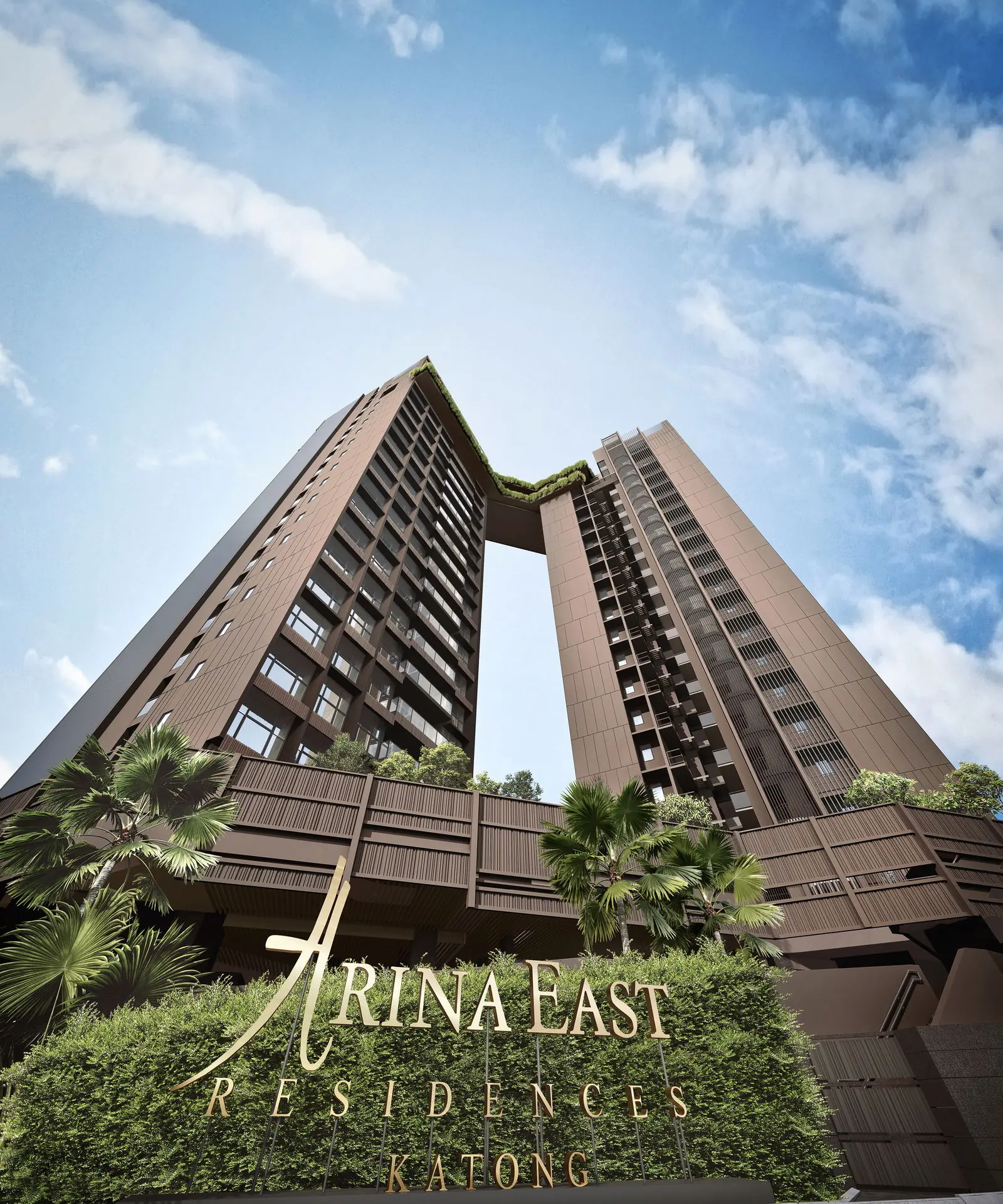 Low-angle architectural view of the brown facade and sky bridge at Arina East Residences freehold condo.