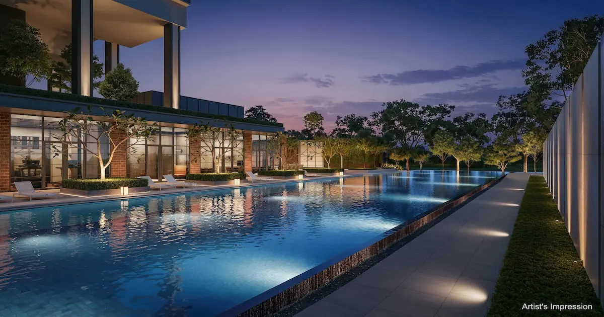 Hudson Place Residences 50-metre lap pool at dusk with the brick-clad Hudson Club clubhouse glowing alongside.