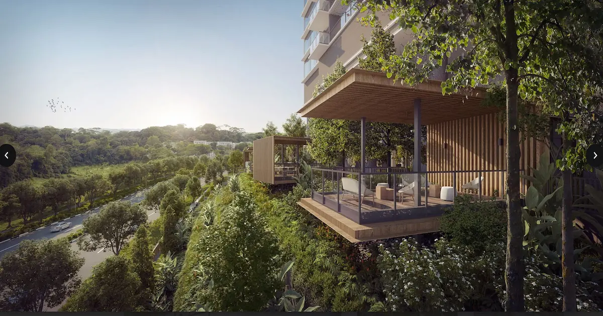 Elevated view of a modern, open-air pavilion with slatted walls and glass balustrades, projecting over a lush green landscape buffer alongside a road.