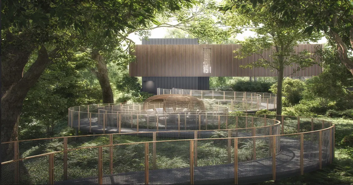 Curving elevated metal mesh walkway winding through dense mature trees, surrounding a woven dome-shaped seating pod.
