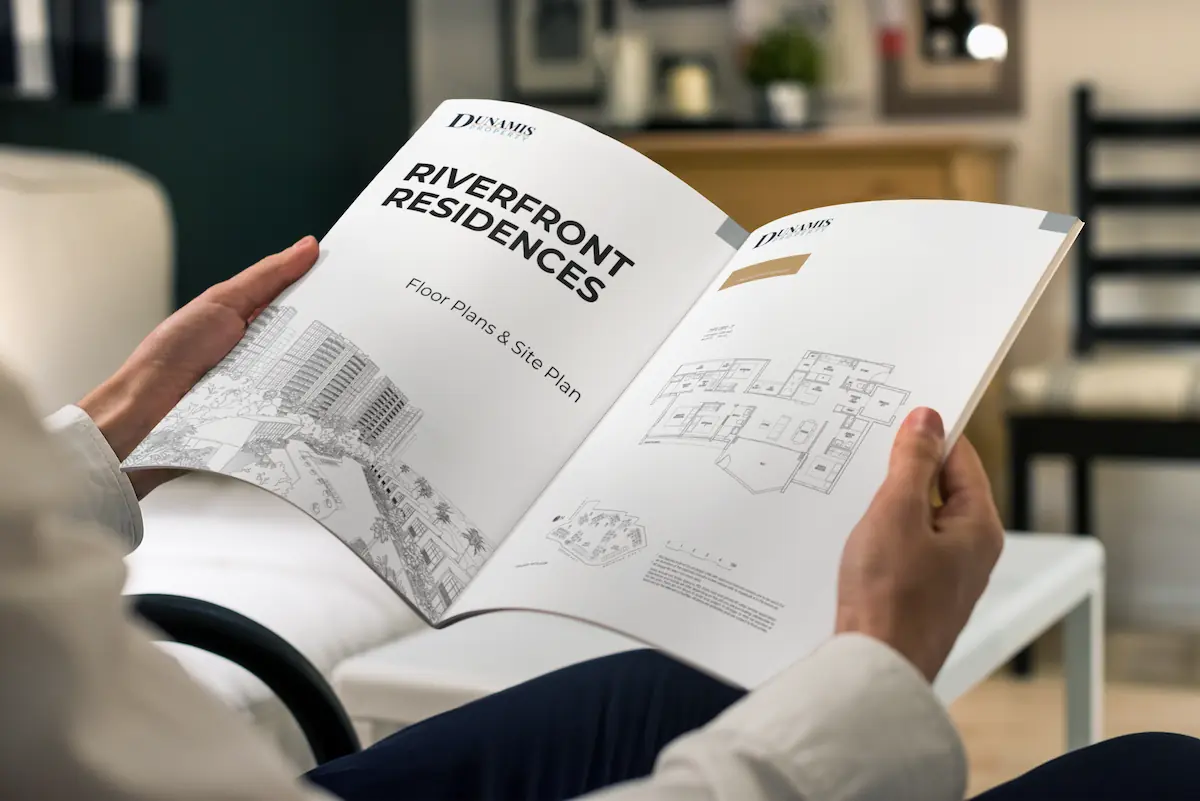 Riverfront Residences floor plan and site plan booklet by Dunamis Property, open to a 1-bedroom premium layout.