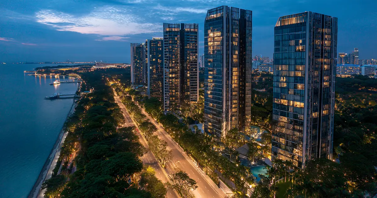 Singapore resale condo archive — twilight aerial view of post-TOP residential towers along East Coast, representing the catalogue of fully sold projects covered by Dunamis.